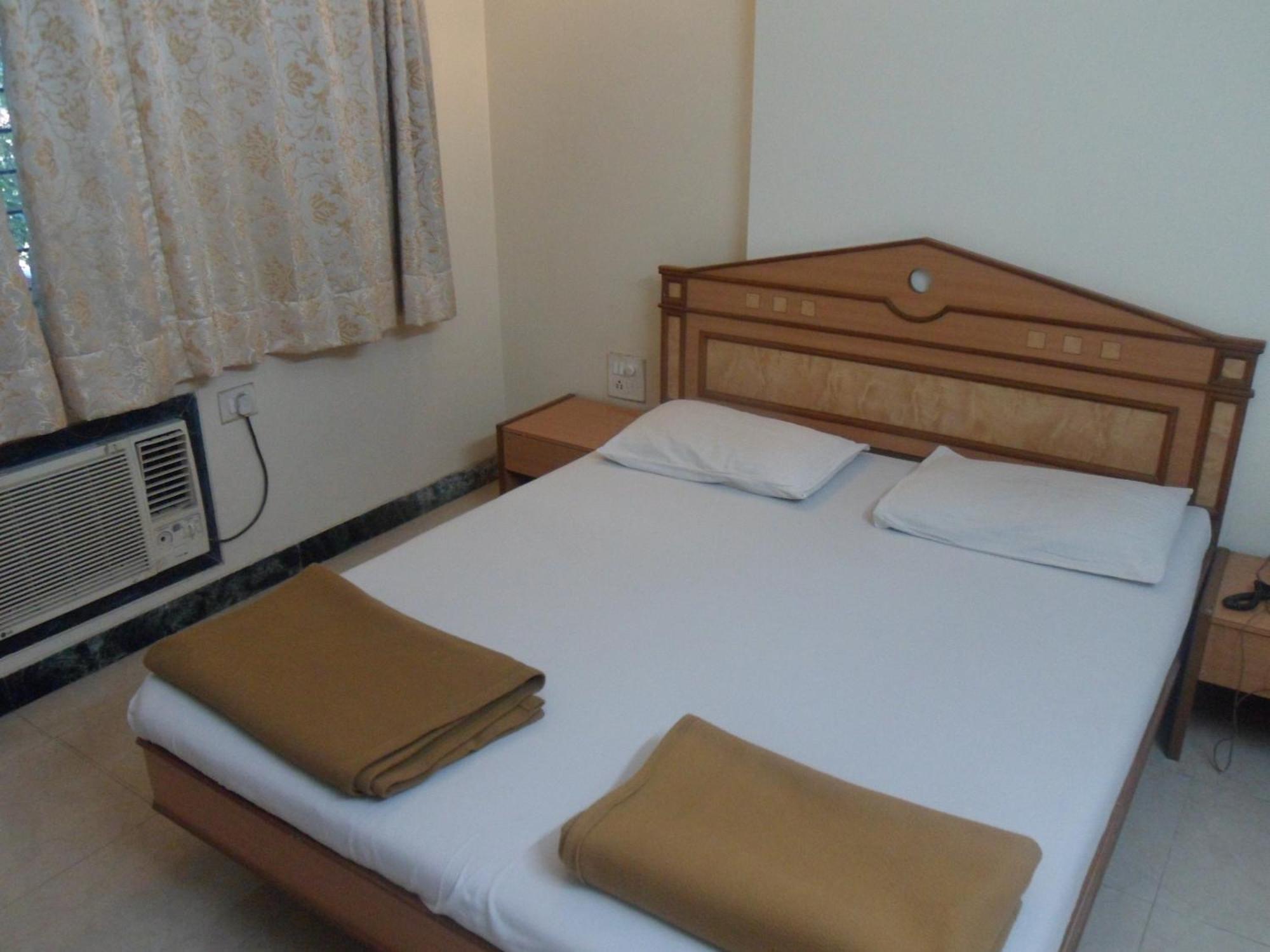 Hotel Pooja International ナーシク 部屋 写真